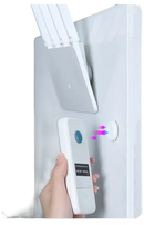 Trendy white remote control on Magnetix Wall Hooks invisible key organizer