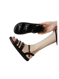 Black buckled sandal.