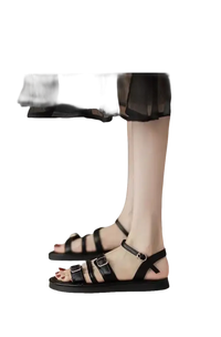 Black buckled sandal shoes.