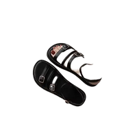Black leather buckle sandals.