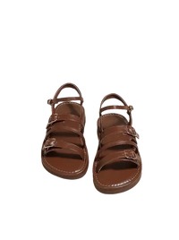 Brown buckled sandals.
