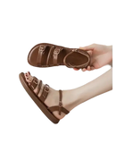Brown leather buckled sandals.