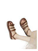 Brown leather buckled sandals.