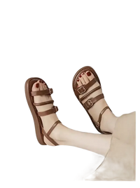 Brown leather buckled sandals.