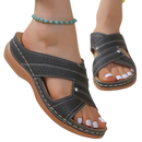 Black perforated criss-cross sandals.