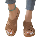 Brown criss-cross perforated sandals.