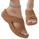 Brown perforated wedge sandals.