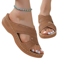 Brown perforated wedge sandals.