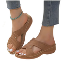 Brown perforated criss-cross platform sandals.