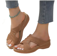 Brown perforated criss-cross platform sandals.