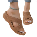 Brown perforated criss-cross sandals.