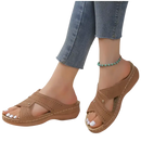 Brown perforated criss-cross sandals.
