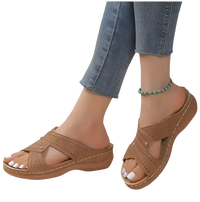 Brown perforated criss-cross sandals.