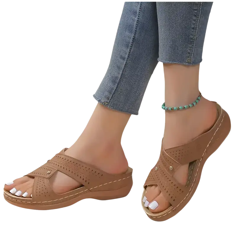 Brown perforated criss-cross sandals.