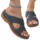 Gray perforated wedge sandals.