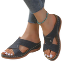 Gray perforated criss-cross sandals.
