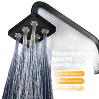 Black square shower head with multiple water outlets.