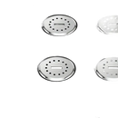Black surface with four circular, perforated, metal fixtures.