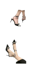 Elegant high-heeled shoes with rhinestone embellishments.