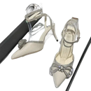 Elegant, pointed-toe high heels with rhinestone embellishments.