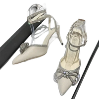 Elegant, pointed-toe high heels with rhinestone embellishments.