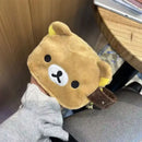 Brown plush bear pouch.