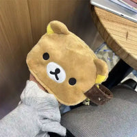 Brown plush bear pouch.