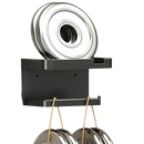 Black wall-mounted pot lid organizer.