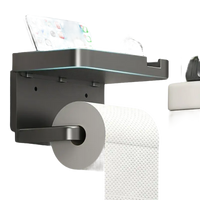 Gray toilet paper holder with shelf.