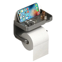 Gray toilet paper holder with shelf.