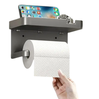 Gray toilet paper holder with shelf.