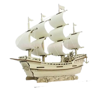 Wooden ship model with sails.