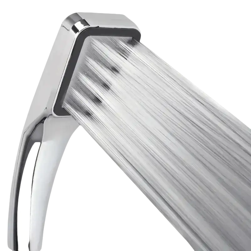 Chrome shower head with water flowing.