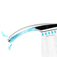 Chrome shower head with water flow.