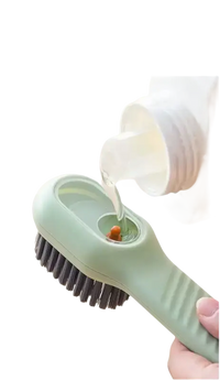 Green cleaning brush with liquid dispenser.