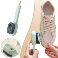 Shoe cleaning brush with soap dispenser.