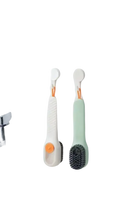 Two hanging cleaning brushes.
