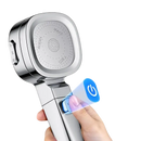 Chrome shower head with stop button.