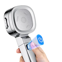 Chrome shower head with stop button.