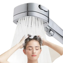 Chrome shower head with water flowing.