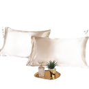 Two beige silk pillowcases.
