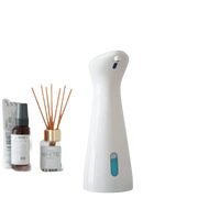 White automatic soap dispenser.