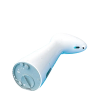 White automatic soap dispenser.