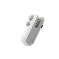 White and gray handheld bag sealer.