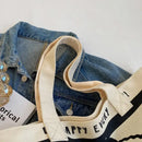 Canvas tote bag with handles.