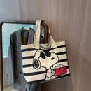 Snoopy-themed striped tote bag.