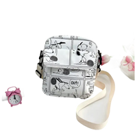 White Snoopy comic-strip crossbody bag.