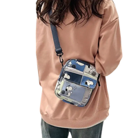 Snoopy comic-strip crossbody bag.