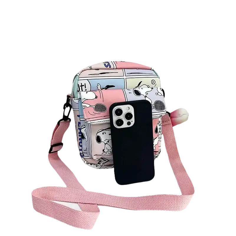 Snoopy cartoon crossbody bag with pink strap.