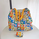 Snoopy-themed reusable shopping bag with yellow straps.